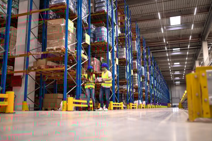 warehouse-workers-discussing-about-logistics-distribution-packages-market